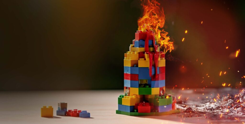 Thematic image of a Lego building on fire.