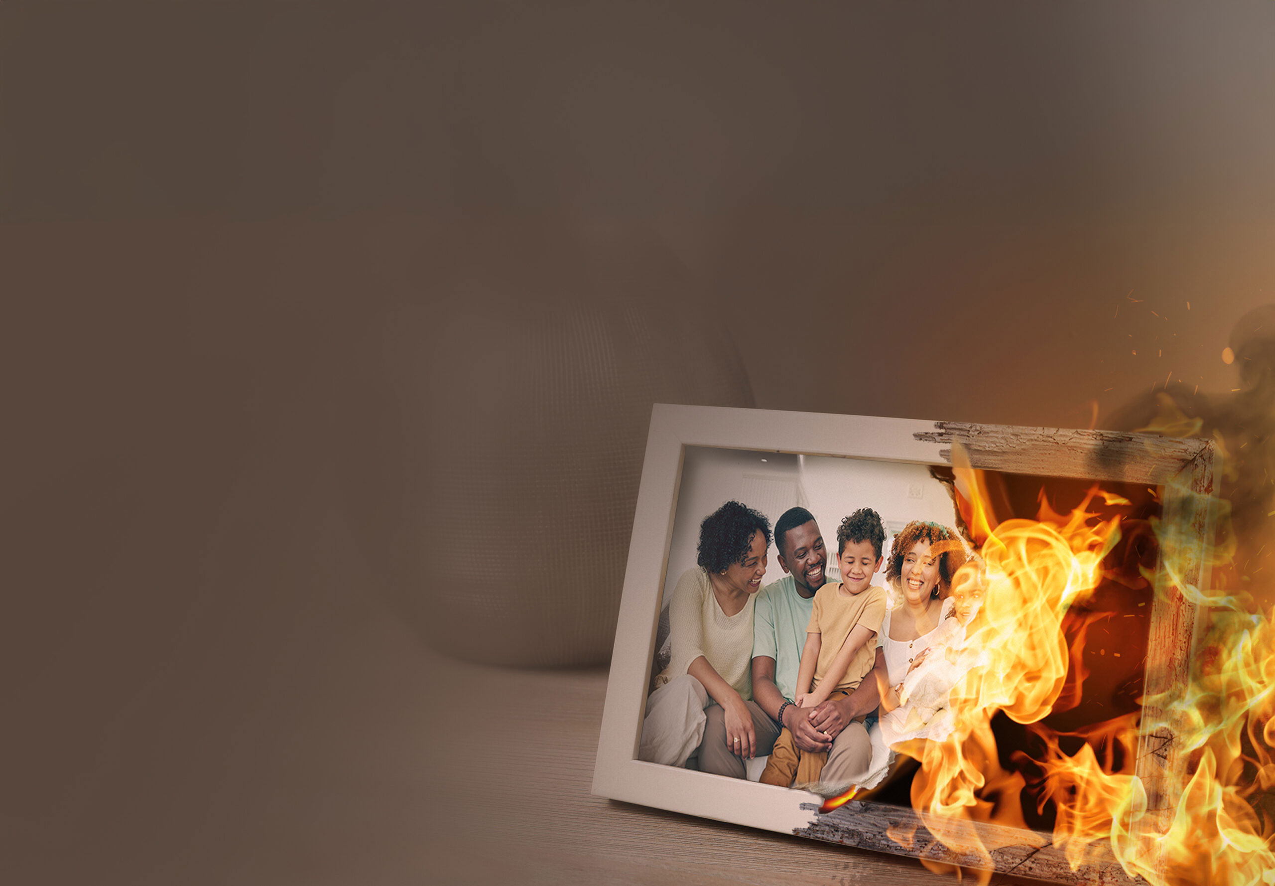 Family photo on desk, ablaze