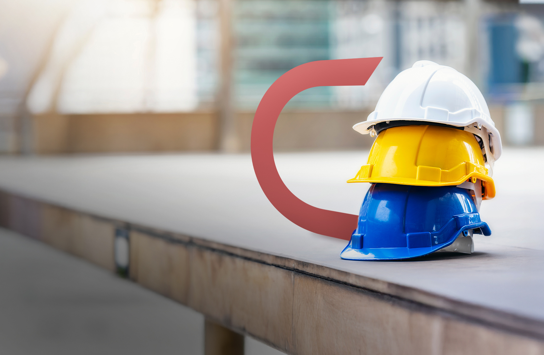 Awhite arcihtect's hat on top of a Construction worker's hat on top of another hat.
