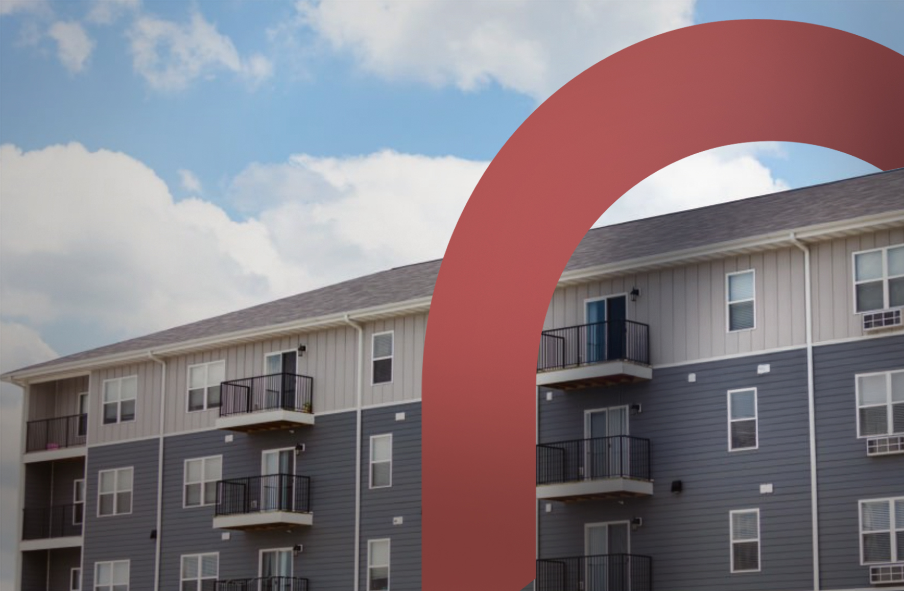 Townhomes with a blue and cloudy sky
