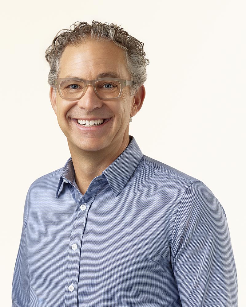 Man in glasses wearing a light blue shirt