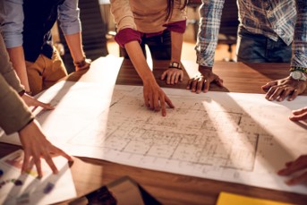 Pointing at a unit on a design blueprint